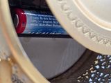 a close up of a container with a toothbrush and toothpaste