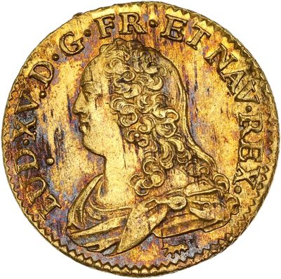 gros plan d'une pièce d'or sur laquelle figure une femme