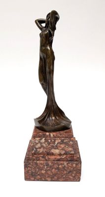 bronze statue of a woman holding a vase on a marble base