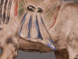 a statue of a horse with a saddle on it ' s back