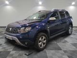 a picture of a blue dacia parked on a checkered floor