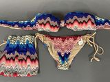 an image of a bikini and panties are shown on a gray surface