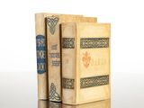 two books sitting on top of each other on a table