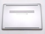 a white laptop with a small screen on a table