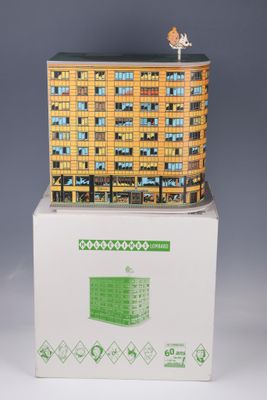 a small model of a building on top of a box
