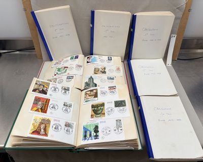 several open books sitting on top of a glass table next to each other
