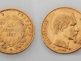 two gold sovereigns, one with the head of a man and the other of a woman