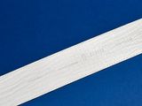 a close up of a piece of wood on a blue surface