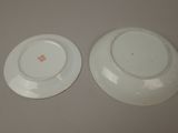 two plates that are sitting next to each other on a table