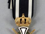 a close up of a medal with a cross on it