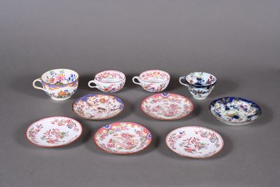 several different types of porcelain dishes and cups on a gray surface