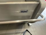 stainless steel hand rail in a commercial kitchen with a logo on it