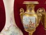 many vases that are sitting on a table