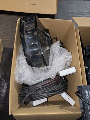 a box of electronics that is sitting on the floor
