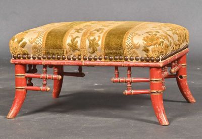 an image of a red bench with a gold and red upholstered seat