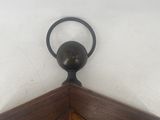 a close up view of a corner of a wall with a clock on it
