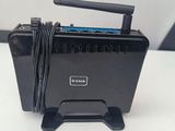 a small black box with a cord on top of it