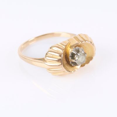 an image of a gold ring with a white diamond in the center