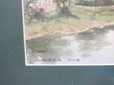a picture of a painting of a house by the water