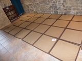 a room that has a mat on the floor in it