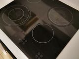 a black and white stove top in a kitchen