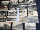 several old black and white photographs of people and buildings on a table