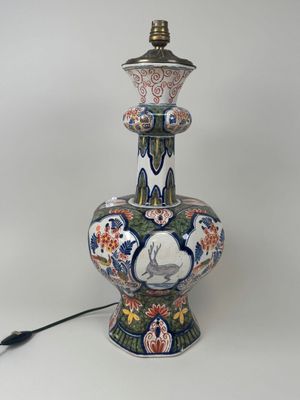 a lamp that is sitting on a table next to a lamp