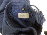 the back of a blue jacket with a label on it