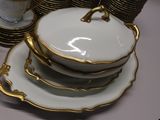 a stack of plates and bowls on a table