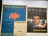 a poster of a man holding a gun next to a poster of a man holding a gun