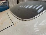 an old car that is parked in a garage