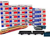 a train that is sitting next to a stack of boxes
