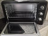 a toaster oven sitting on a counter in a kitchen