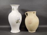 two vases sitting next to each other on a table