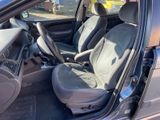 the interior of a car with the door open and the seats down