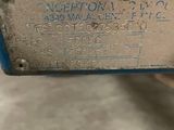 an image of a close up of a piece of metal with a tag on it