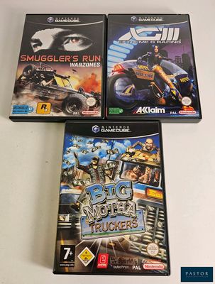 three video games are sitting on a table with a white background