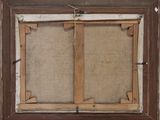 an old picture frame with a picture hanging on a wall