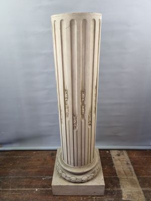 an image of a tall white vase sitting on top of a wooden table