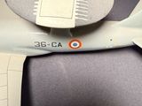 a model of a plane with a red circle on the wing