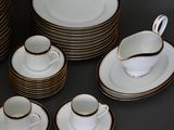 a lot of plates and cups on the table