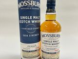 a bottle of mossburn single malt scotch whisky next to a cardboard box