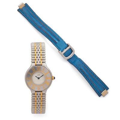 a close up of a wrist watch with a blue strap