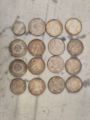 a lot of coins that are sitting on a table