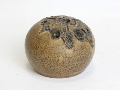 an image of a ceramic object on a white surface