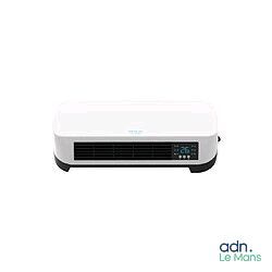 a white air conditioner sitting on top of a white table
