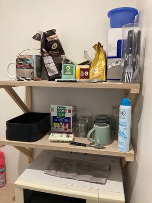 a shelf with various items on it in a room
