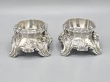 pair of antique silverplated candlesticks on pedestals