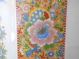 a large vase with a colorful floral design on it