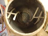 a cement mixer sitting in the middle of a room